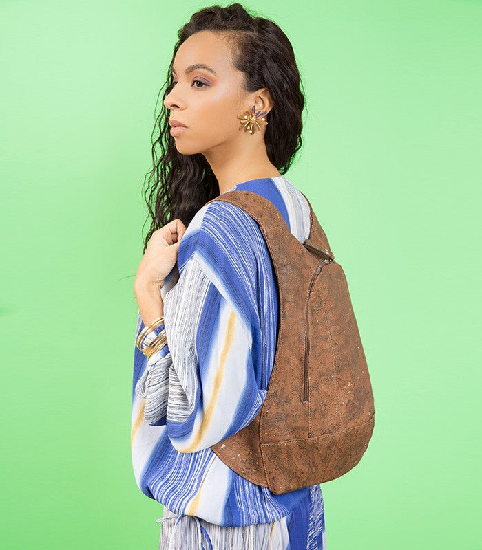 photo of the dark natural cork Arsayo backpack with a woman model