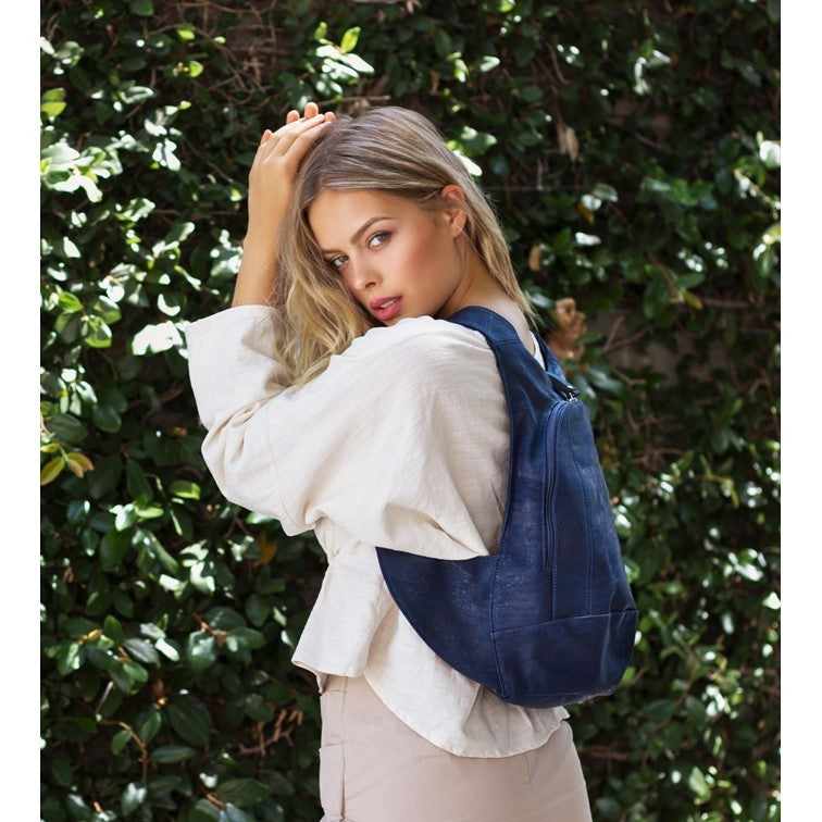photo of the blue navy Arsayo  backpack with a woman model