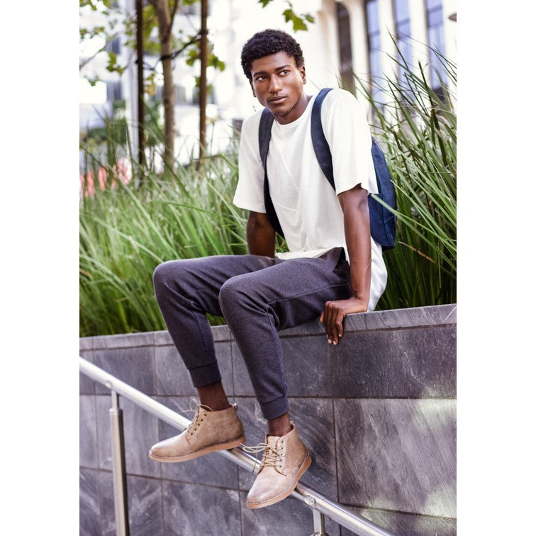 photo of the blue navy Arsayo backpack with a man model