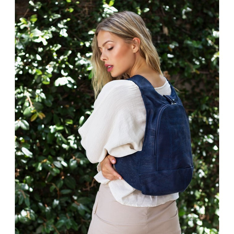 photo of the blue navy Arsayo  backpack with a woman model